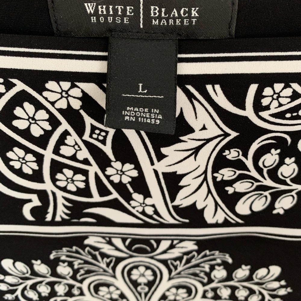 Black and white above the knee dress.